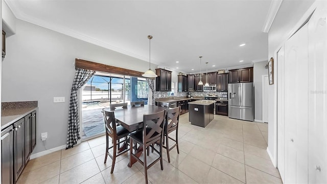 dining space with crown molding, recessed lighting, baseboards, and light tile patterned floors