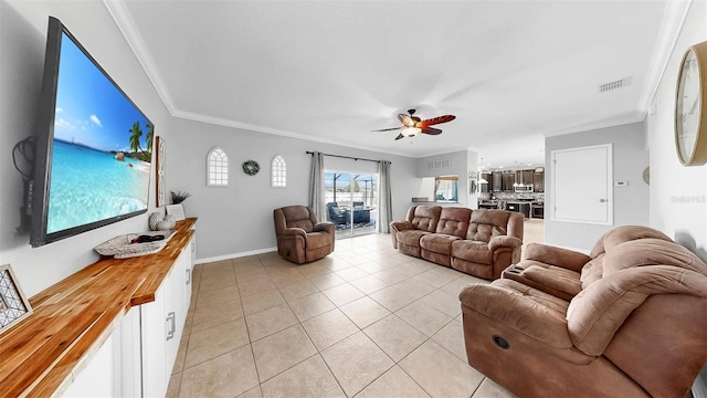 living area with a ceiling fan, visible vents, light tile patterned floors, baseboards, and ornamental molding