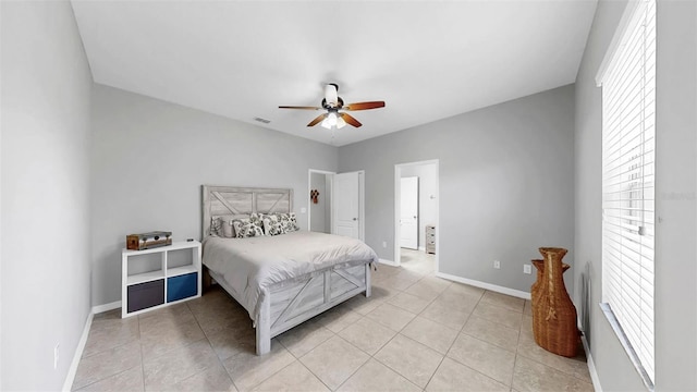 bedroom featuring baseboards, visible vents, and light tile patterned floors