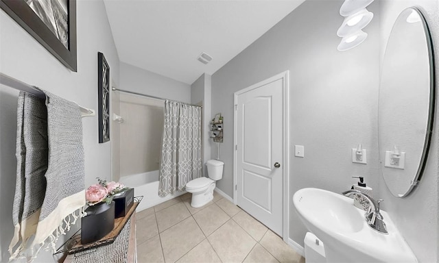 full bathroom with a sink, tile patterned flooring, toilet, shower / bath combination with curtain, and visible vents