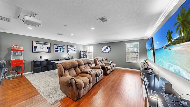 living area featuring visible vents, baseboards, and plenty of natural light