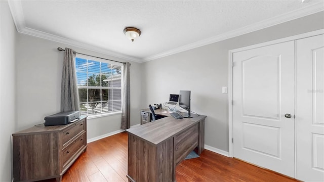 home office featuring baseboards, a textured ceiling, crown molding, and dark wood-style floors