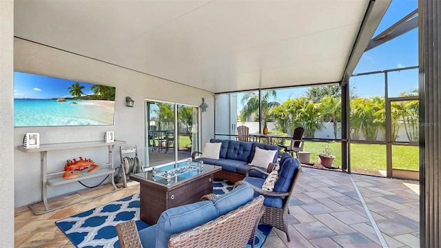 sunroom with a wall of windows and an outdoor hangout area