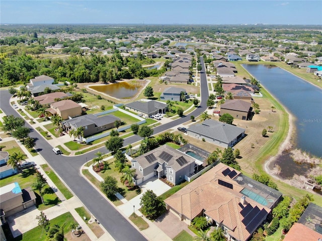 aerial view featuring a water view and a residential view