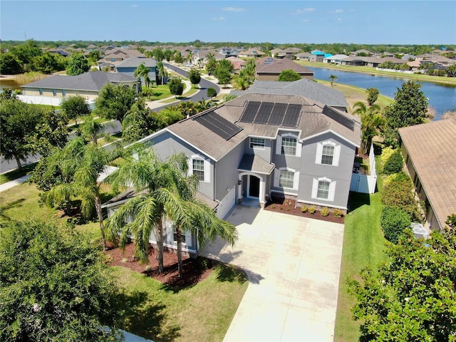 birds eye view of property featuring a water view and a residential view