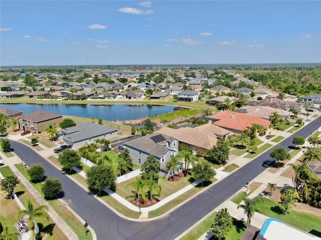 aerial view with a water view and a residential view