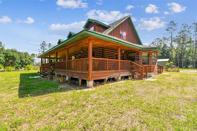 view of side of home featuring a lawn and board and batten siding