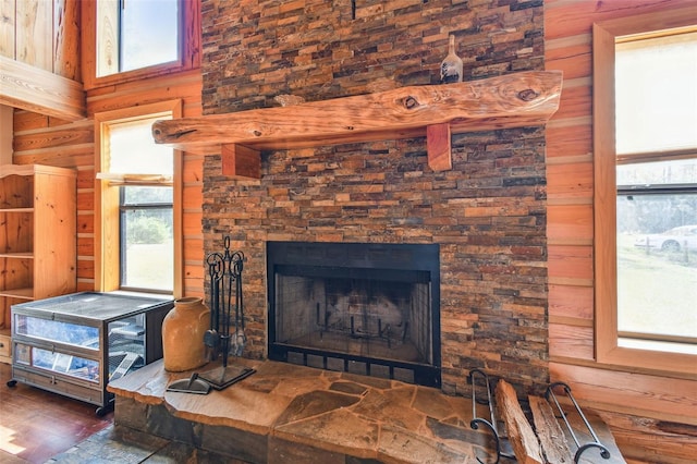 details featuring a fireplace and wood finished floors
