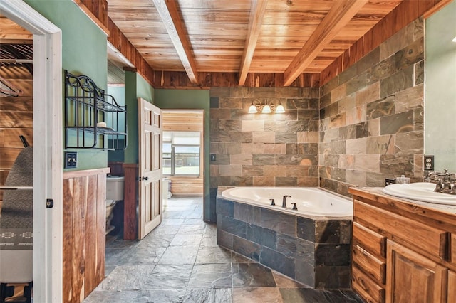 full bathroom with stone tile flooring, toilet, wood ceiling, a garden tub, and beam ceiling