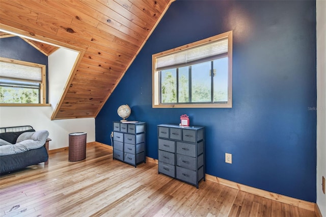 bonus room featuring wooden ceiling, lofted ceiling, baseboards, and wood finished floors