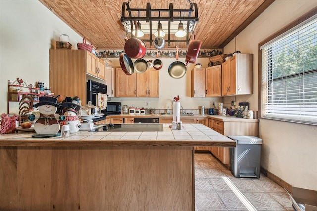 kitchen with wooden ceiling, baseboards, tile counters, a peninsula, and black appliances