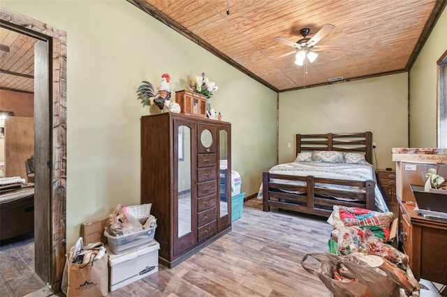 bedroom featuring crown molding, wooden ceiling, and wood finished floors