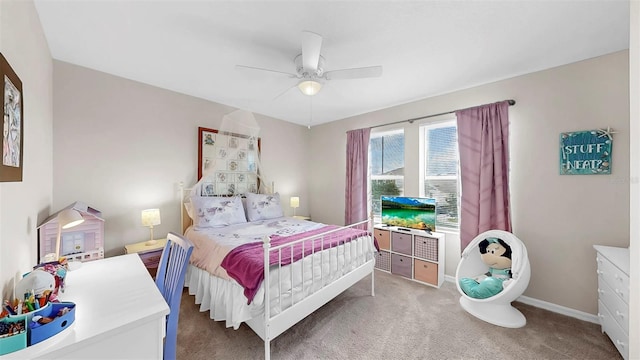 carpeted bedroom featuring baseboards and ceiling fan