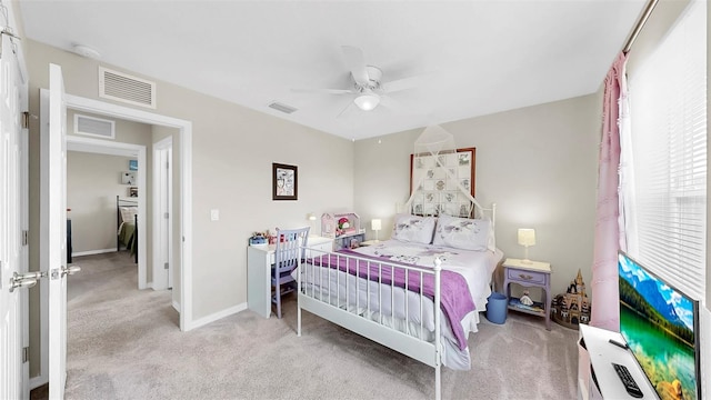 carpeted bedroom with baseboards, ceiling fan, and visible vents