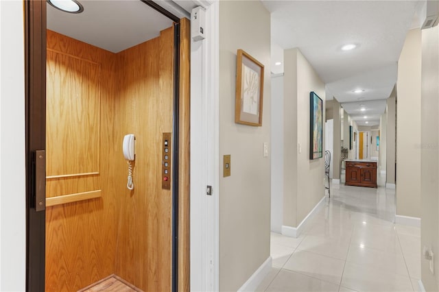 1750 Arabian Ln, Palm Harbor, FL 34685 - hall with elevator, baseboards, light tile patterned floors, and recessed lighting