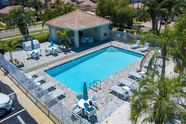 1750 Arabian Ln, Palm Harbor, FL 34685 - community pool featuring fence and a patio