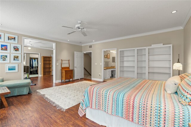 1750 Arabian Ln, Palm Harbor, FL 34685 - bedroom featuring wood finished floors, crown molding, baseboards, recessed lighting, and a textured ceiling