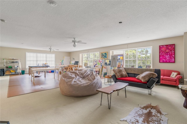 1750 Arabian Ln, Palm Harbor, FL 34685 - carpeted living room with a textured ceiling and a ceiling fan