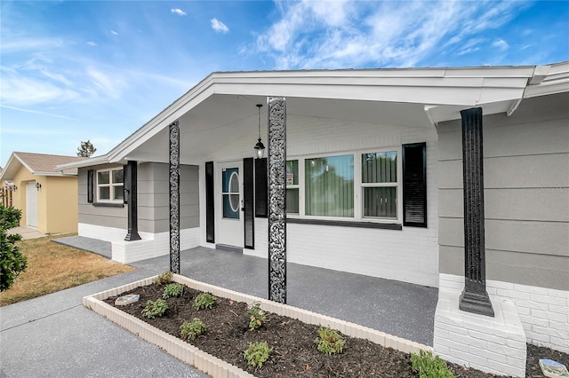 1516 Roundtree Rd, Holiday, FL 34690 - view of front facade featuring a porch