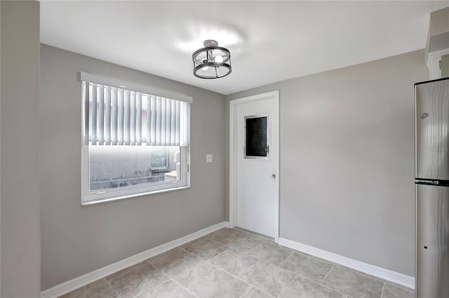 1516 Roundtree Rd, Holiday, FL 34690 - empty room featuring baseboards