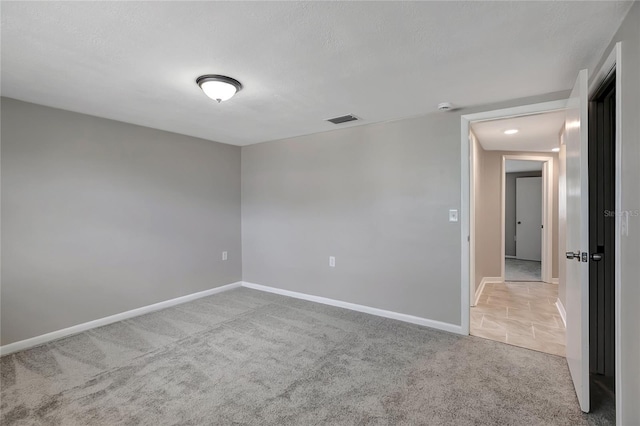 1516 Roundtree Rd, Holiday, FL 34690 - carpeted empty room featuring visible vents and baseboards