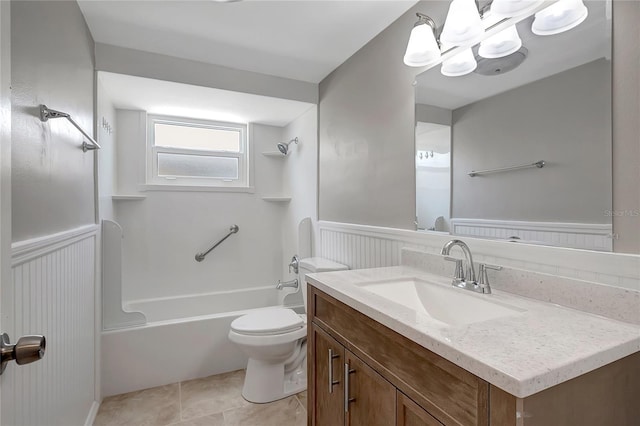 1516 Roundtree Rd, Holiday, FL 34690 - bathroom with vanity, a wainscoted wall, toilet, and shower / washtub combination
