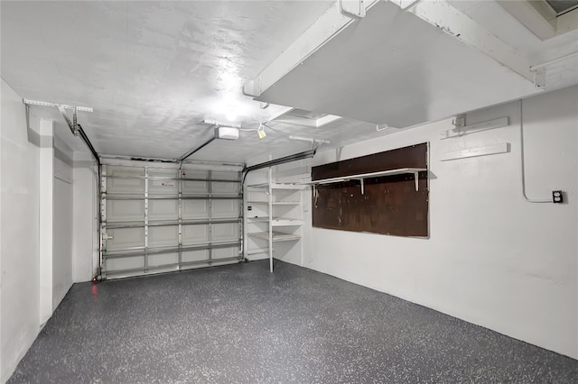 1516 Roundtree Rd, Holiday, FL 34690 - garage featuring a garage door opener