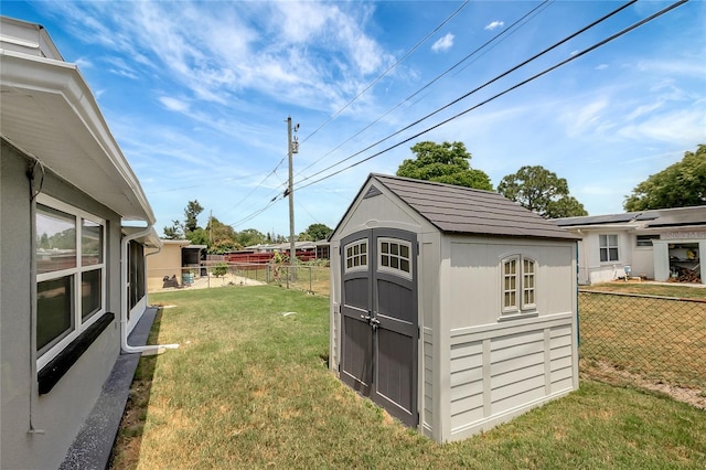 1516 Roundtree Rd, Holiday, FL 34690 - view of shed featuring fence