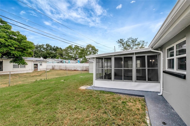 1516 Roundtree Rd, Holiday, FL 34690 - view of yard with fence and a sunroom