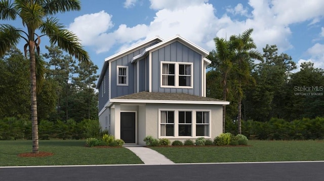 view of front of house featuring a front lawn and board and batten siding