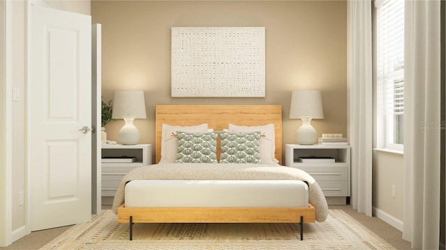 carpeted bedroom featuring baseboards and multiple windows