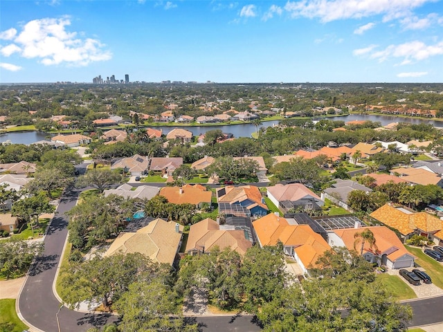 drone / aerial view with a water view and a residential view