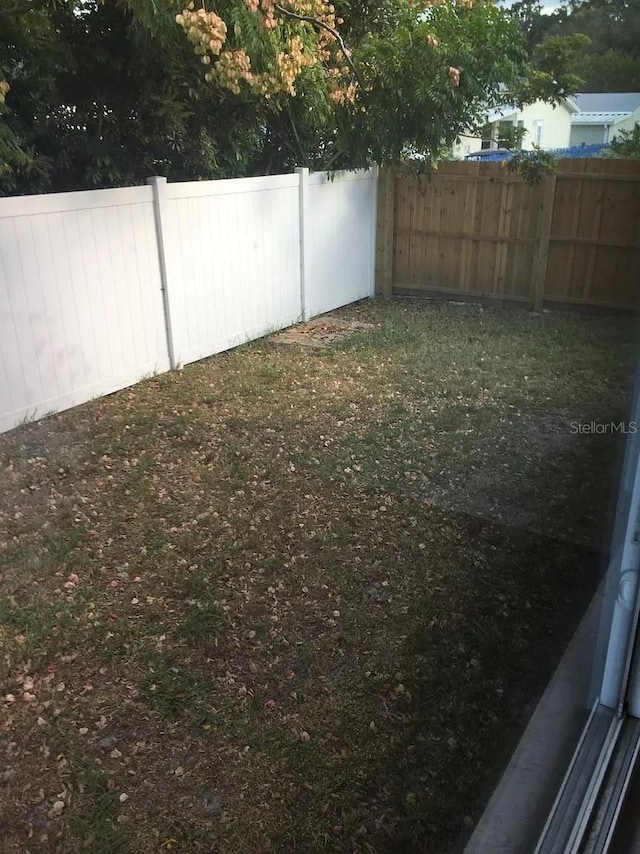 3115 Winchester Dr, Dunedin, FL 34698 - view of yard with fence