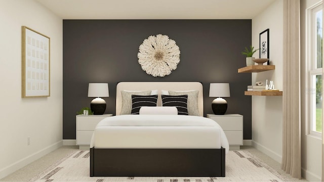 bedroom with light colored carpet, baseboards, and an accent wall