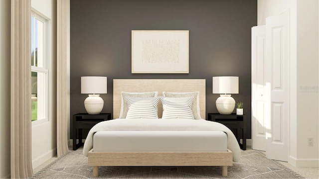 carpeted bedroom featuring baseboards