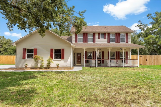 2512 Rustic Oaks Dr, Lutz, FL 33559 - colonial-style house with ceiling fan and a shingled roof