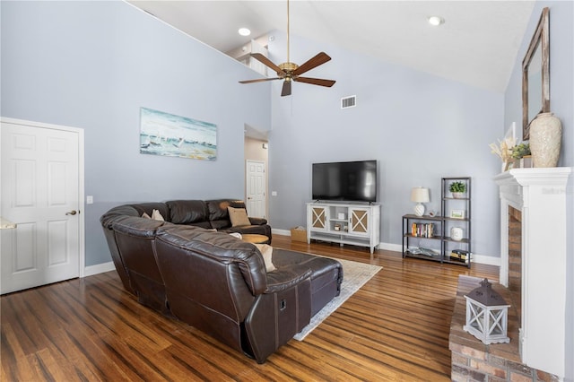 2512 Rustic Oaks Dr, Lutz, FL 33559 - living area featuring ceiling fan, high vaulted ceiling, baseboards, wood finished floors, and a brick fireplace