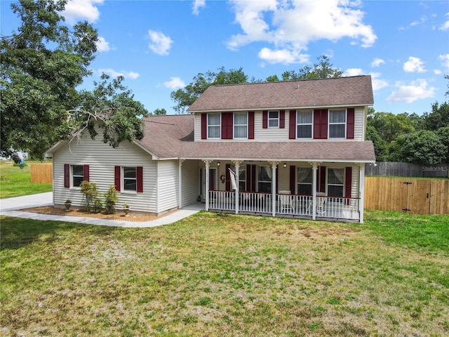 2512 Rustic Oaks Dr, Lutz, FL 33559 - view of front of property featuring covered porch and a shingled roof