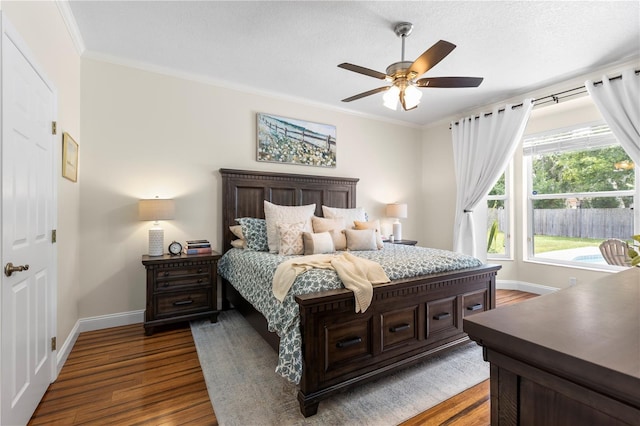 2512 Rustic Oaks Dr, Lutz, FL 33559 - bedroom featuring dark wood-type flooring, baseboards, ornamental molding, and a ceiling fan