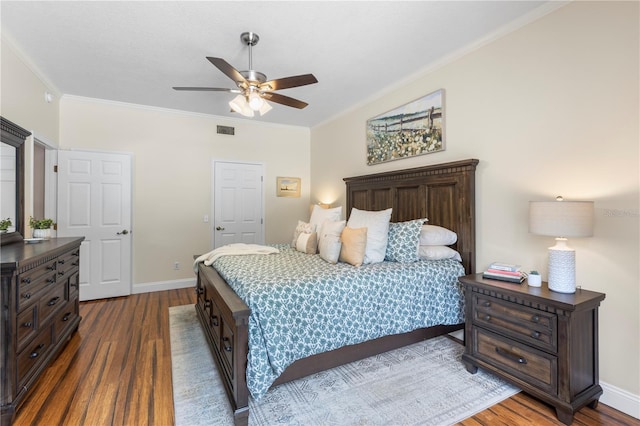 2512 Rustic Oaks Dr, Lutz, FL 33559 - bedroom featuring dark wood-style flooring, ornamental molding, baseboards, and ceiling fan
