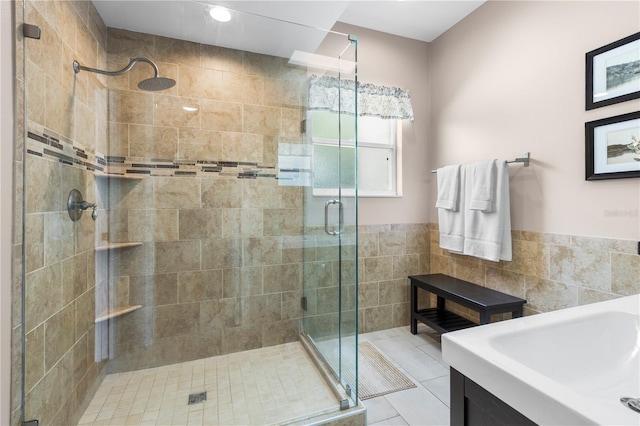 2512 Rustic Oaks Dr, Lutz, FL 33559 - bathroom featuring tile walls, a stall shower, recessed lighting, wainscoting, and vanity