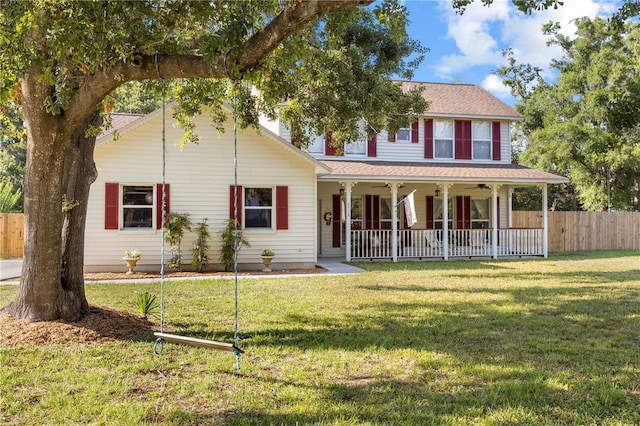 2512 Rustic Oaks Dr, Lutz, FL 33559 - view of front of property featuring ceiling fan, a shingled roof, and covered porch
