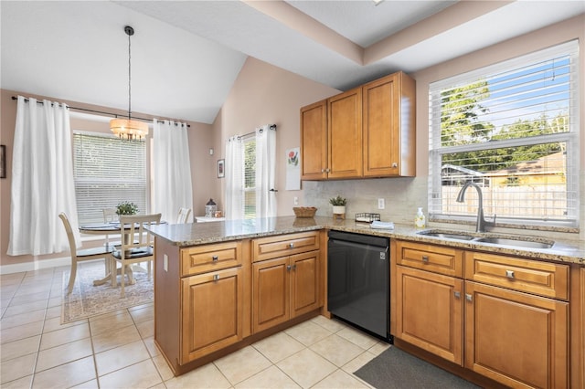 2512 Rustic Oaks Dr, Lutz, FL 33559 - kitchen with dishwashing machine, a sink, brown cabinets, a peninsula, and light stone counters