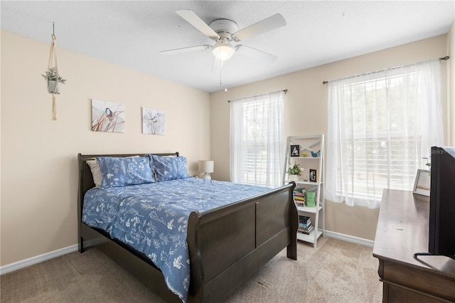 2512 Rustic Oaks Dr, Lutz, FL 33559 - bedroom with light colored carpet, baseboards, and a ceiling fan