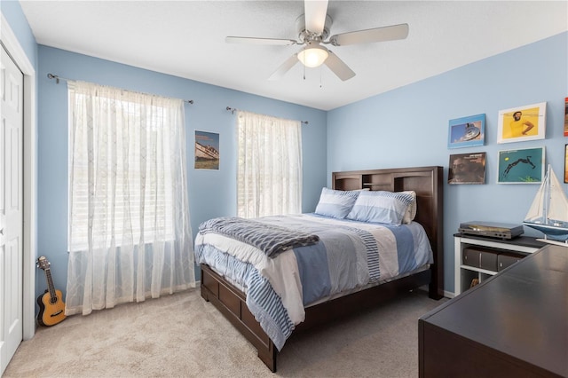 2512 Rustic Oaks Dr, Lutz, FL 33559 - carpeted bedroom with ceiling fan and a closet
