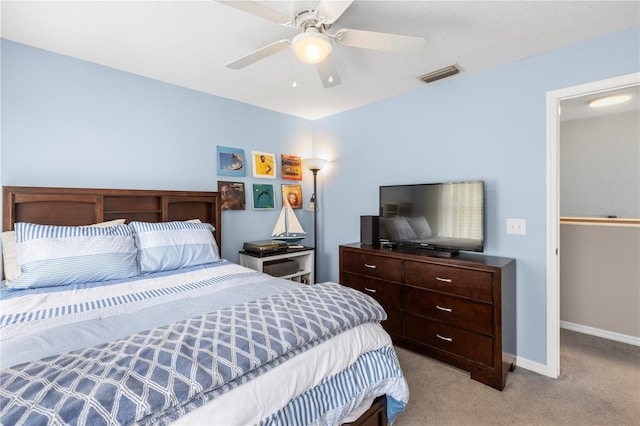 2512 Rustic Oaks Dr, Lutz, FL 33559 - bedroom featuring light carpet, baseboards, and a ceiling fan