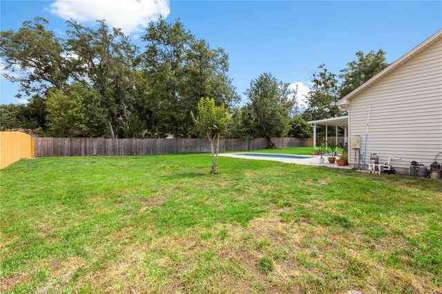 2512 Rustic Oaks Dr, Lutz, FL 33559 - view of yard featuring a patio area