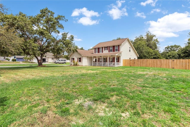 2512 Rustic Oaks Dr, Lutz, FL 33559 - back of house featuring a porch