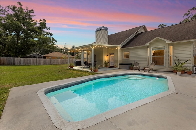 2512 Rustic Oaks Dr, Lutz, FL 33559 - pool at dusk with a patio