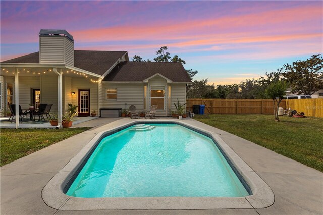 2512 Rustic Oaks Dr, Lutz, FL 33559 - pool at dusk featuring a patio area